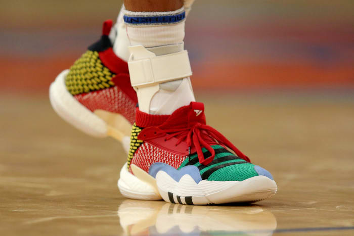 View of Trae Young's multi-color Adidas shoes.